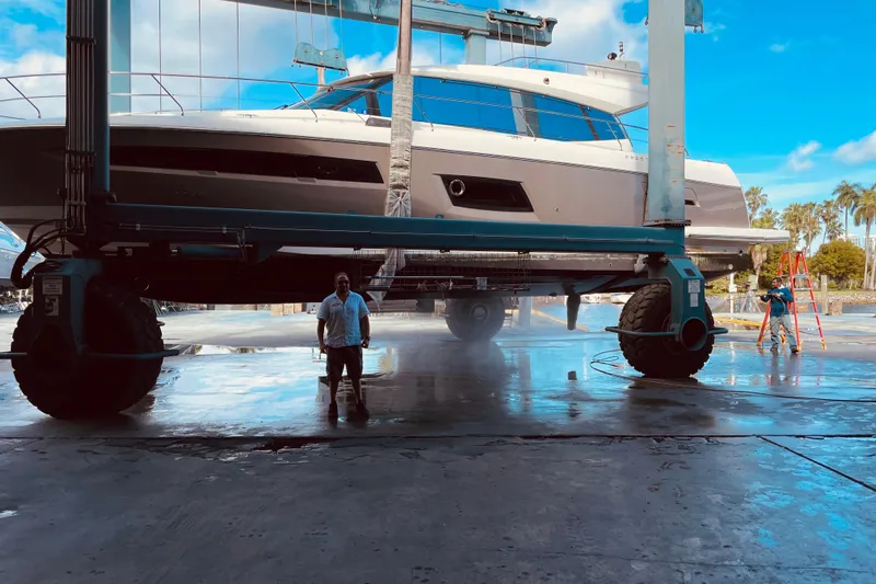  Yacht Photos Pics 2013 Prestige 550 S yacht lifted for maintenance at a marina.