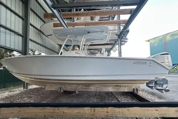  Yacht Photos Pics 2015 Jupiter 30 CC boat in storage, side view, under shelter.