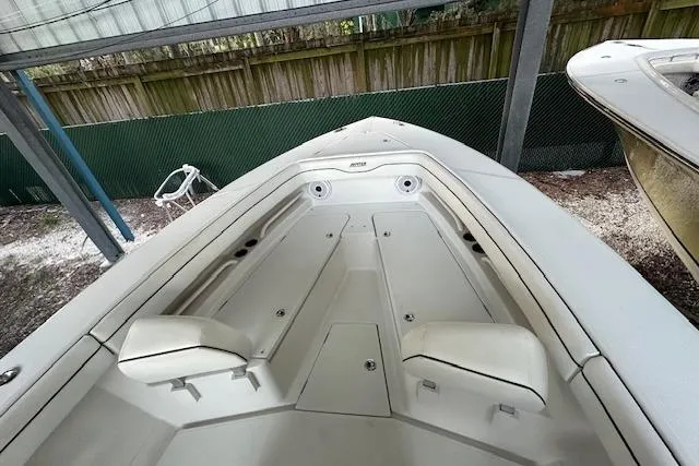  Yacht Photos Pics 2015 Jupiter 30 CC boat deck with seating and storage compartments.