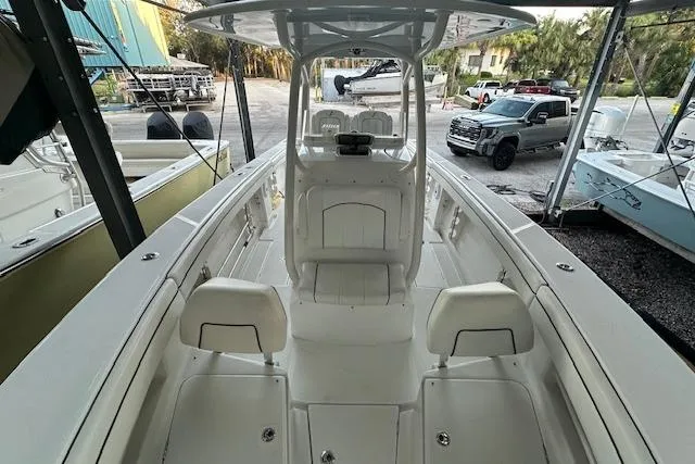  Yacht Photos Pics 2015 Jupiter 30 CC boat interior with seating and console, parked in a marina.