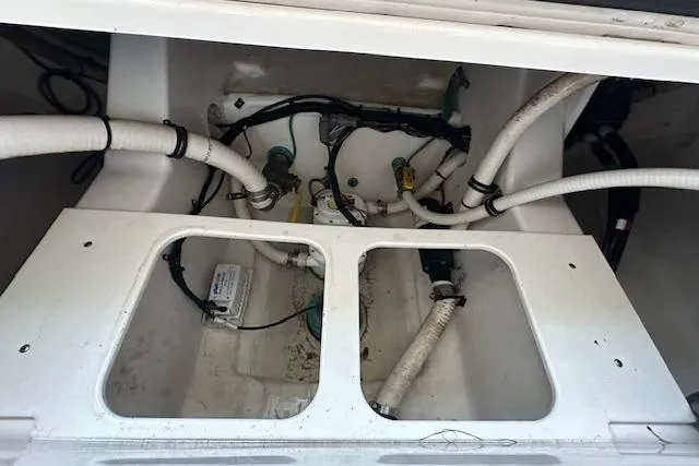  Yacht Photos Pics 2015 Jupiter 30 CC boat interior showing plumbing and wiring components.