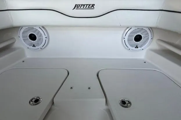  Yacht Photos Pics Interior of 2015 Jupiter 30 CC boat with speakers and storage compartments.