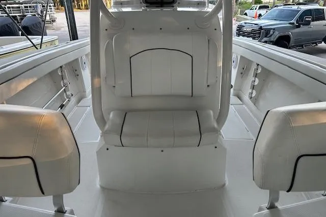  Yacht Photos Pics Interior view of a 2015 Jupiter 30 CC boat with white seating.