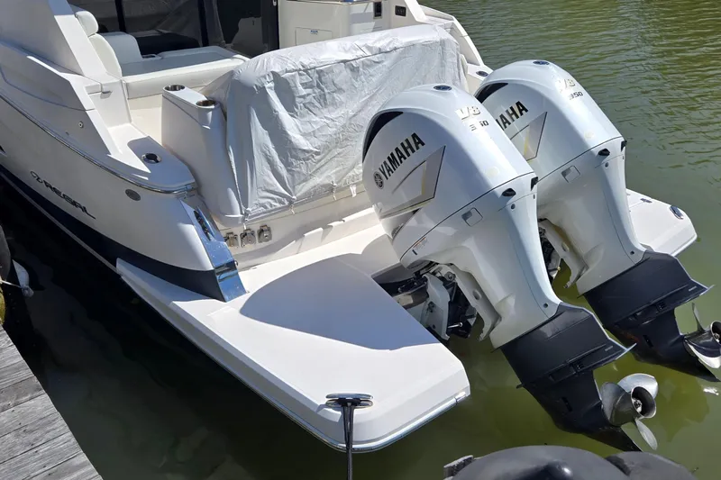  Yacht Photos Pics 2021 Regal 36 XO boat with twin Yamaha V8 350 engines docked in water.