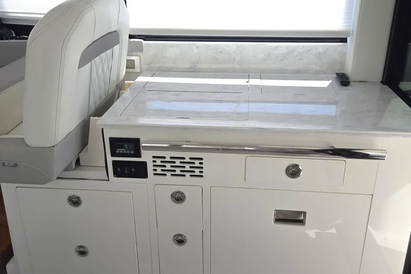  Yacht Photos Pics Interior of 2021 Regal 36 XO yacht featuring sleek white cabinetry and modern design.