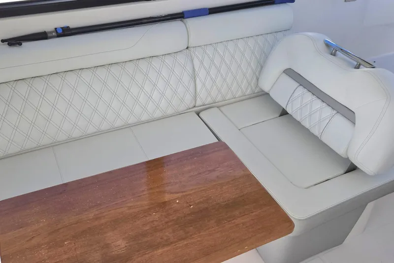  Yacht Photos Pics Luxurious seating area on 2021 Regal 36 XO boat with elegant white upholstery.