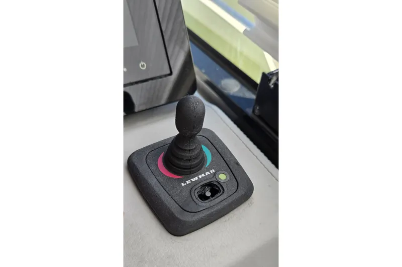  Yacht Photos Pics Joystick control on 2021 Regal 36 XO boat dashboard, featuring Lewmar branding.