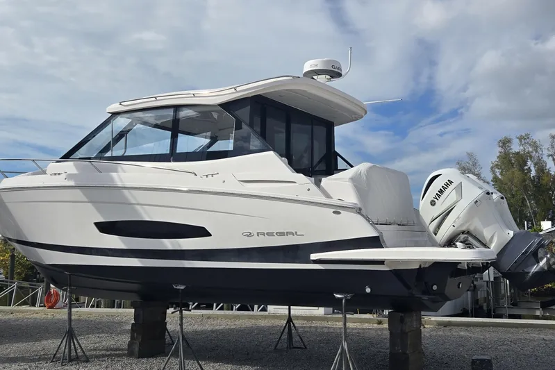 Yacht Photos Pics 2021 Regal 36 XO boat on stands, featuring Yamaha outboard engines.