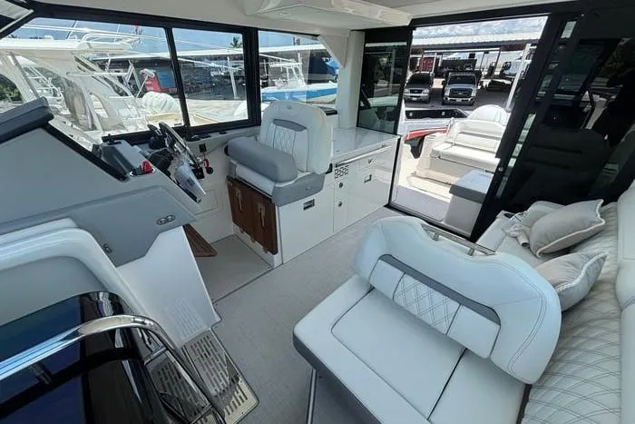 Interior of 2021 Regal 36 XO yacht with modern seating and helm station.