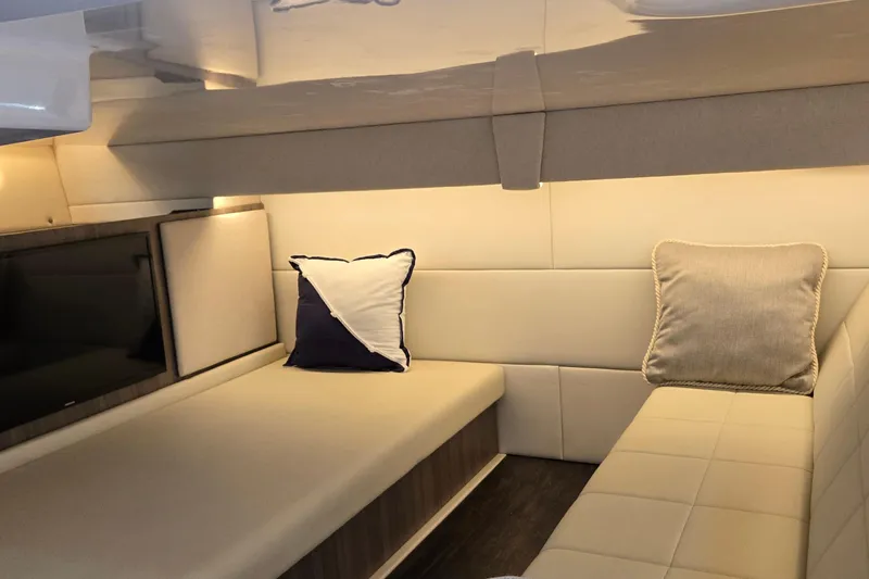  Yacht Photos Pics Luxurious interior of 2021 Regal 36 XO yacht with cozy seating and cushions.