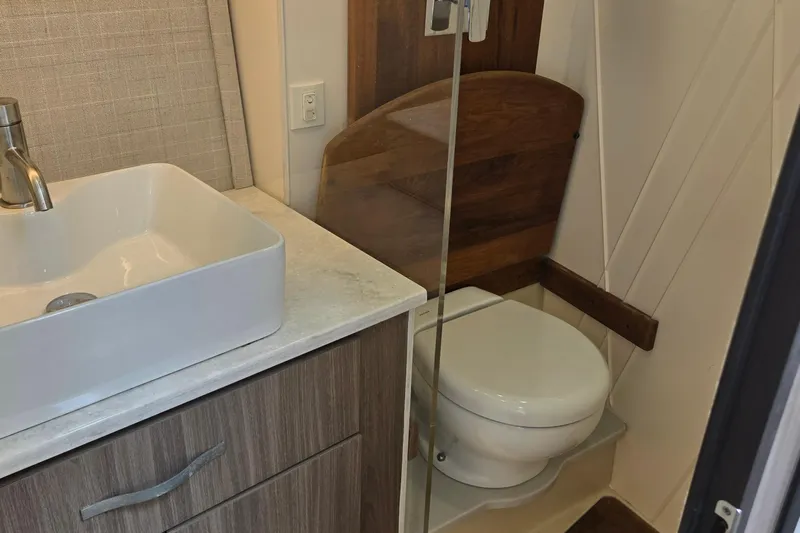  Yacht Photos Pics Modern bathroom in 2021 Regal 36 XO yacht with sink and toilet.