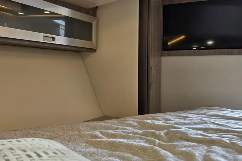  Yacht Photos Pics Interior cabin of 2021 Regal 36 XO yacht with TV and modern design.