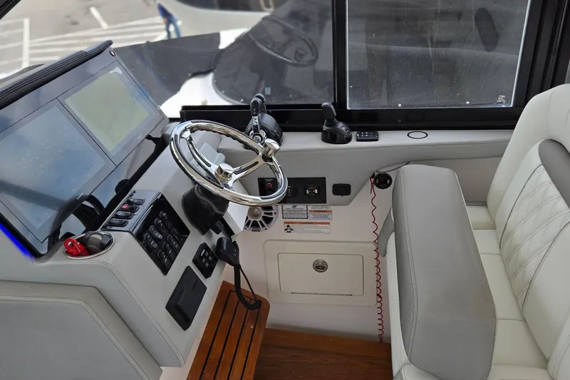  Yacht Photos Pics 2021 Regal 36 XO boat helm with modern controls and luxurious seating.