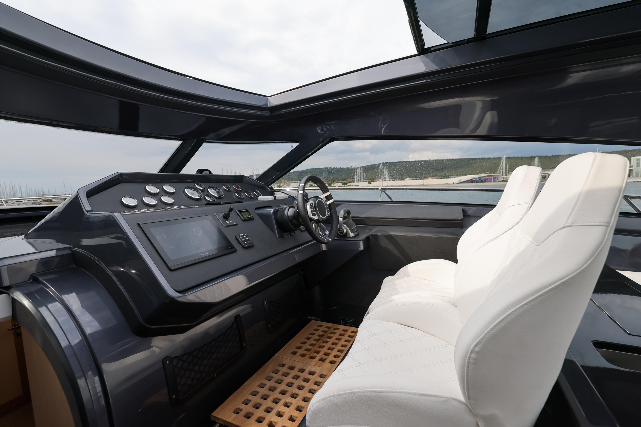 2024 Focus Power 44 yacht cockpit with modern controls and white seating.