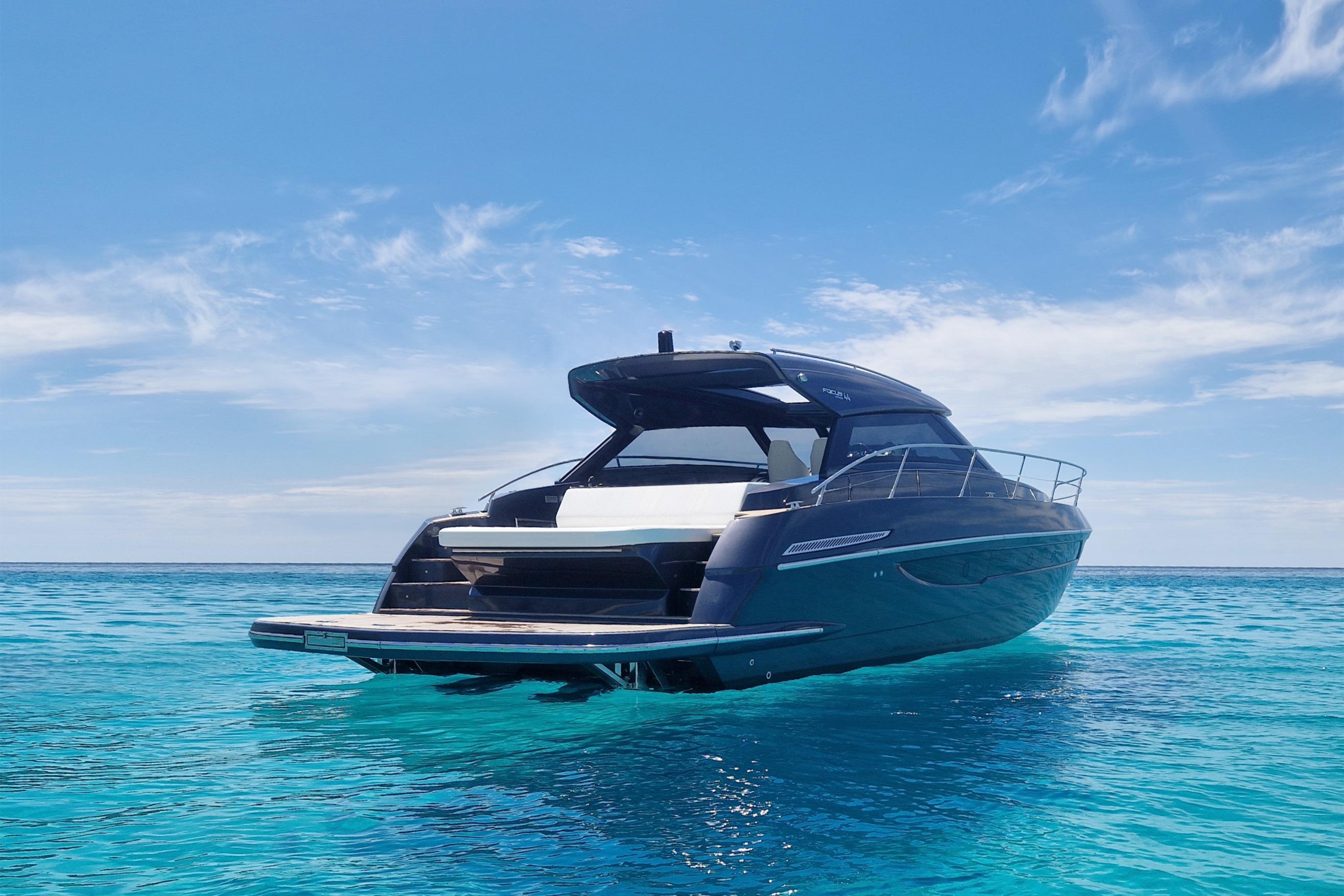 2024 Focus Power 44 yacht on clear blue ocean under a sunny sky.