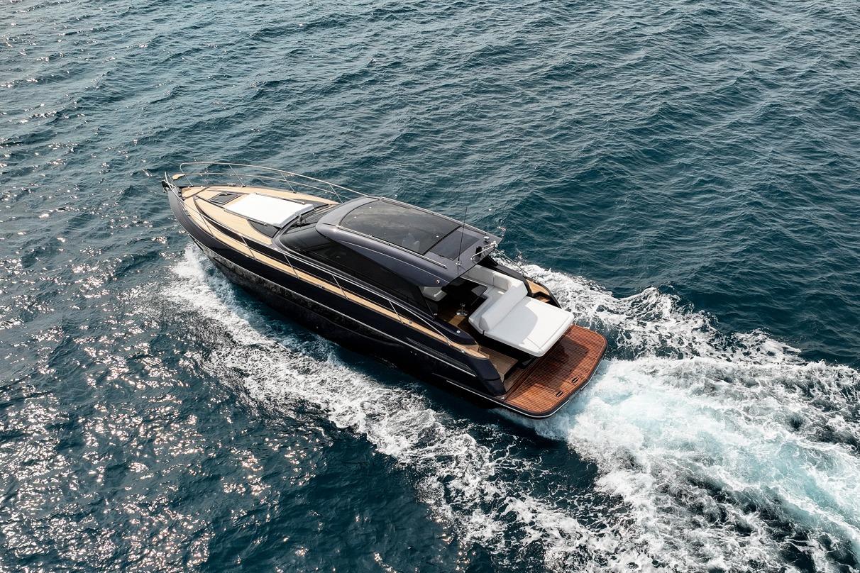 2024 Focus Power 44 yacht cruising on open sea, aerial view.