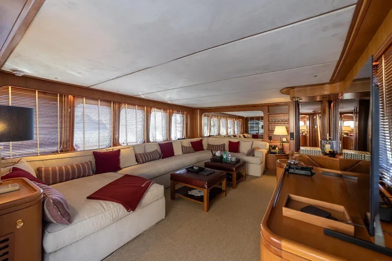  Yacht Photos Pics Luxurious interior of 1986 Moonen 85 yacht with elegant seating and wooden accents.