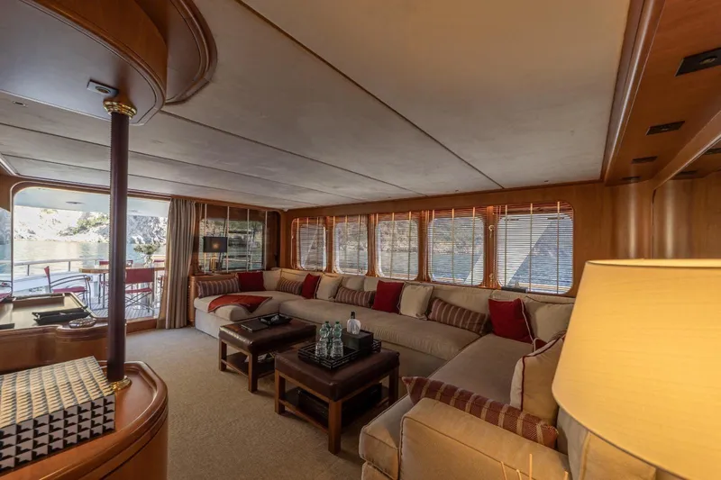  Yacht Photos Pics Luxurious interior of 1986 Moonen 85 yacht with elegant seating and scenic views.