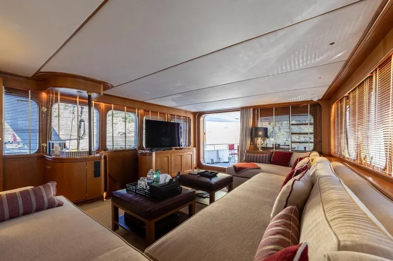  Yacht Photos Pics Luxurious interior of 1986 Moonen 85 yacht with elegant seating and large windows.