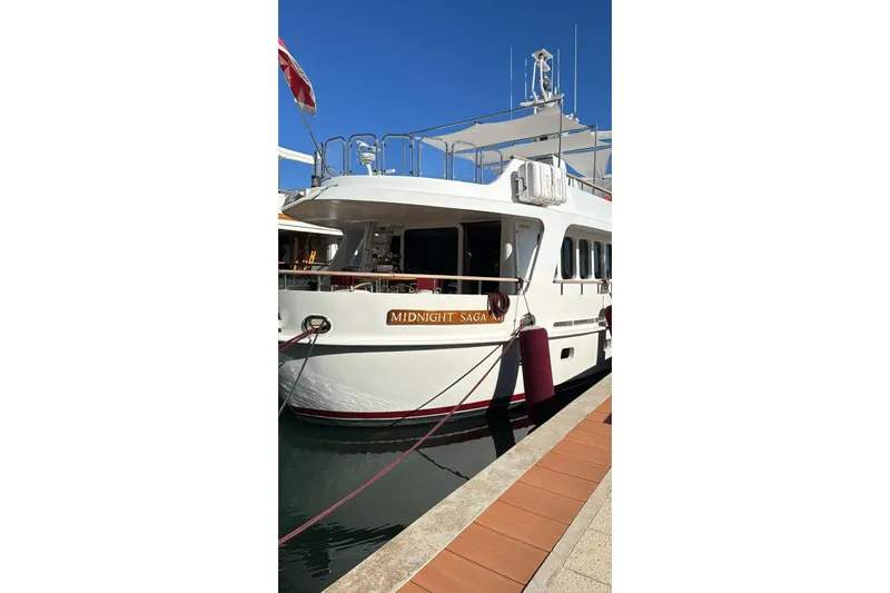  Yacht Photos Pics Luxury yacht "Midnight Saga," Moonen 85, 1986, docked in a sunny marina.