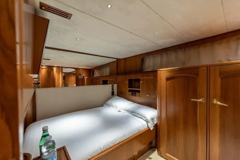  Yacht Photos Pics Luxurious cabin interior of 1986 Moonen 85 yacht with wooden furnishings and cozy bed.