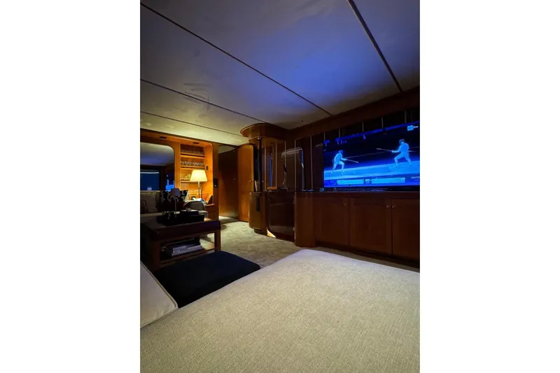  Yacht Photos Pics Luxurious interior of 1986 Moonen 85 yacht with elegant furnishings and large TV screen.