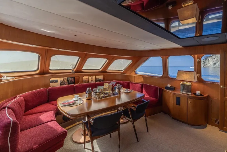  Yacht Photos Pics Luxurious interior of 1986 Moonen 85 yacht with elegant dining area and ocean view.