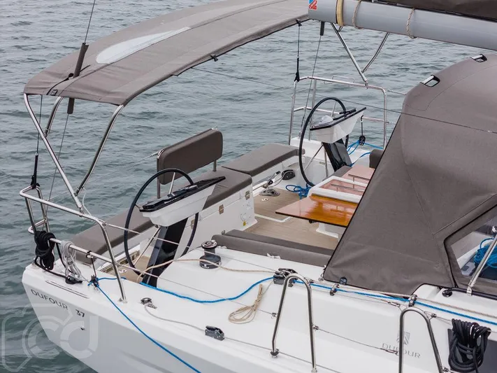In Stock #042 Yacht Photos Pics 2023 Dufour 37 sailboat cockpit with dual steering wheels and canopy.