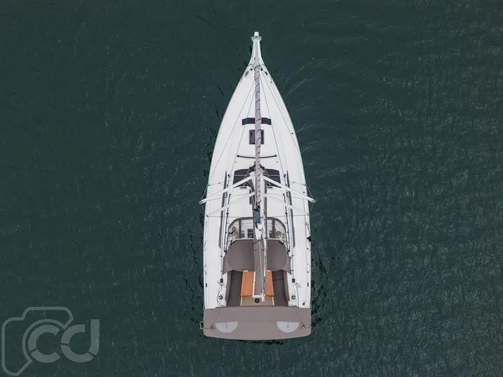 In Stock #042 Yacht Photos Pics Aerial view of 2023 Dufour 37 sailboat on calm water.