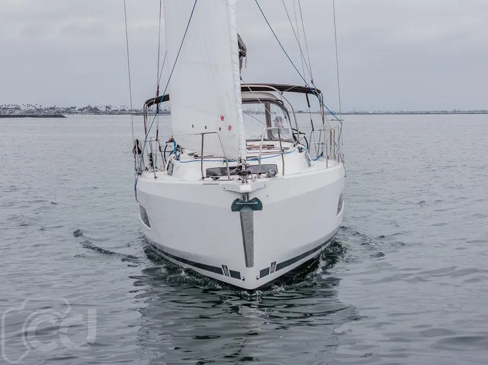 In Stock #042 Yacht Photos Pics 2023 Dufour 37 sailboat on calm water, front view.