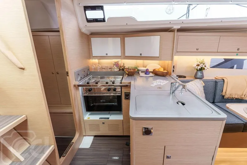 In Stock #042 Yacht Photos Pics Modern kitchen interior of 2023 Dufour 37 yacht with sleek design and amenities.
