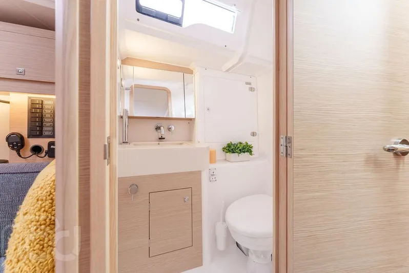 In Stock #042 Yacht Photos Pics Modern bathroom interior of 2023 Dufour 37 yacht, featuring sleek design and natural lighting.