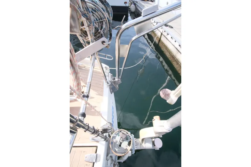 Blue Song Yacht Photos Pics 1984 Amel Maramu 45 sailboat deck with rigging and dock view.