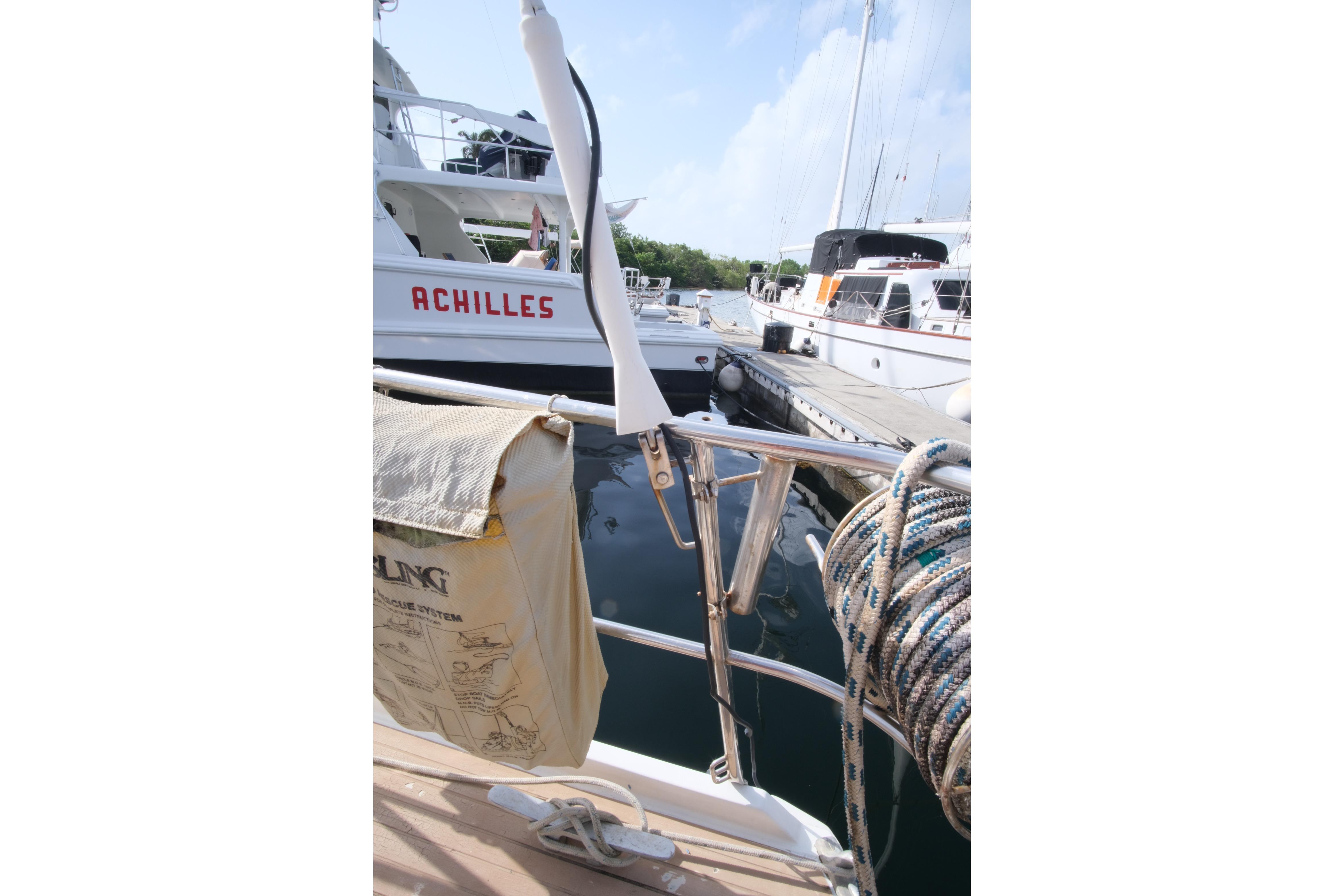 Amel Maramu 45 sailboat docked, featuring ropes and safety equipment, 1984 model.