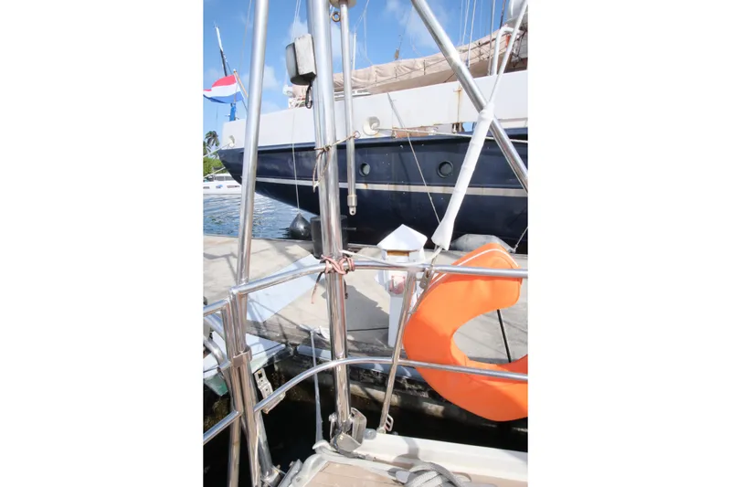 Blue Song Yacht Photos Pics Sailboat docked with orange life ring, Amel Maramu 45, 1984 model.