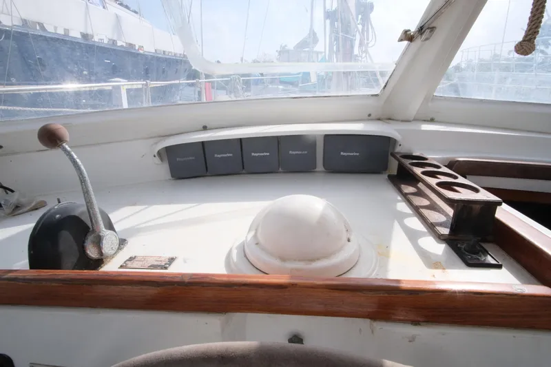 Blue Song Yacht Photos Pics Cockpit of 1984 Amel Maramu 45 sailboat with navigation equipment and controls.