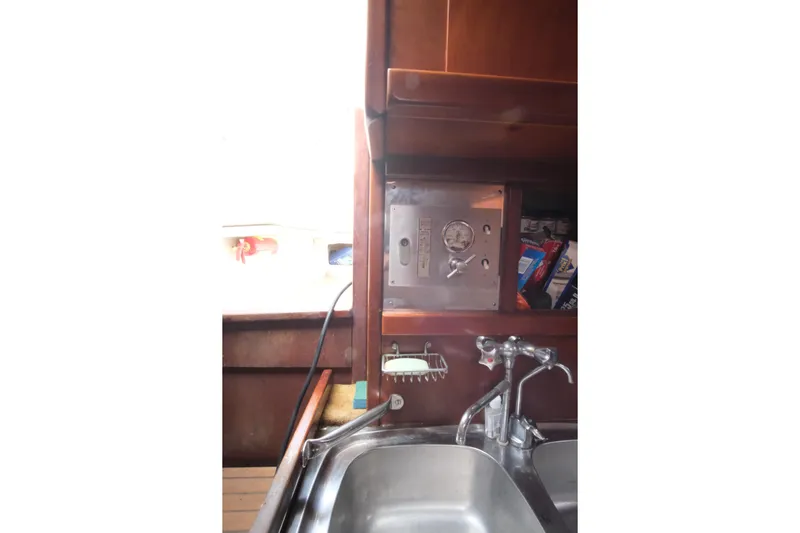 Blue Song Yacht Photos Pics Galley of 1984 Amel Maramu 45 sailboat with sink and storage.