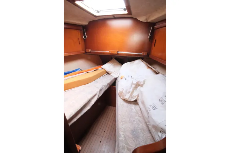 Blue Song Yacht Photos Pics Cozy cabin interior of 1984 Amel Maramu 45 sailboat with wooden finishes.