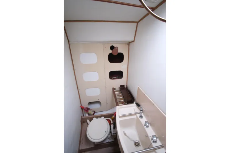 Blue Song Yacht Photos Pics 1984 Amel Maramu 45 yacht bathroom with sink and toilet.