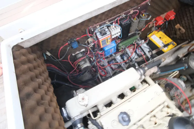 Blue Song Yacht Photos Pics Engine compartment of 1984 Amel Maramu 45 sailboat, showing wiring and components.