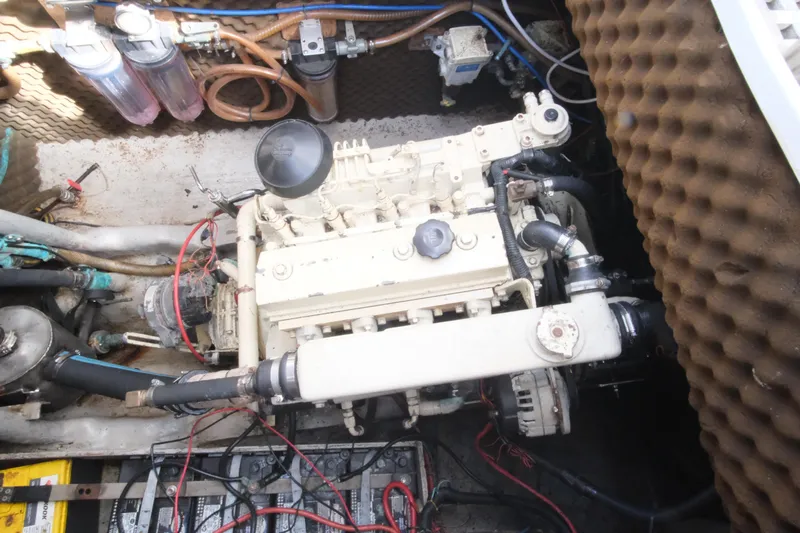 Blue Song Yacht Photos Pics Engine compartment of a 1984 Amel Maramu 45 sailboat, showcasing mechanical components.