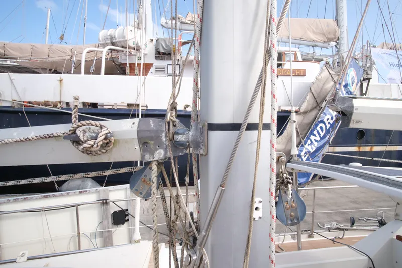 Blue Song Yacht Photos Pics 1984 Amel Maramu 45 sailboat mast and rigging in marina setting.