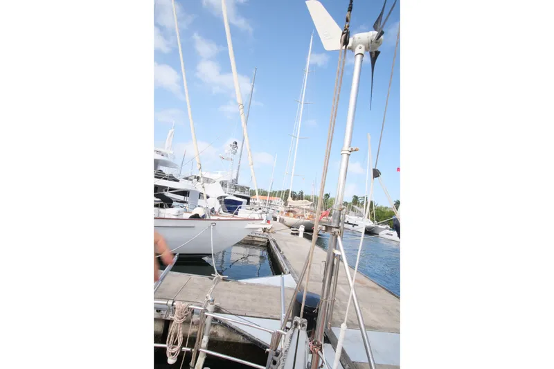 Blue Song Yacht Photos Pics Sailboats docked at marina, featuring 1984 Amel Maramu 45 yacht.