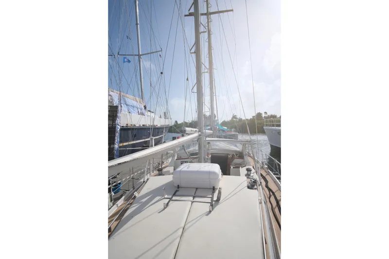 Blue Song Yacht Photos Pics 1984 Amel Maramu 45 sailboat deck view with mast and rigging in marina.