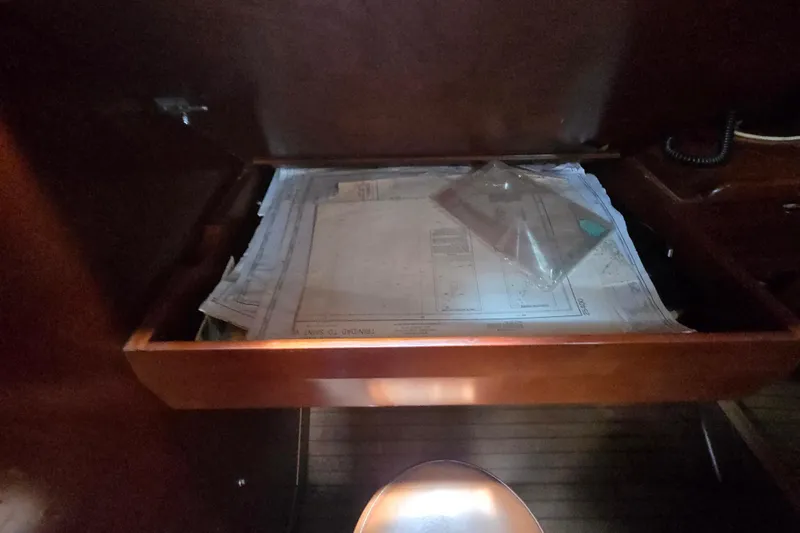 Blue Song Yacht Photos Pics Drawer with nautical charts on 1984 Amel Maramu 45 sailboat.