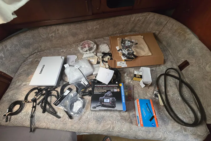 Blue Song Yacht Photos Pics Assorted marine electronics and accessories on a 1984 Amel Maramu 45 sailboat interior.