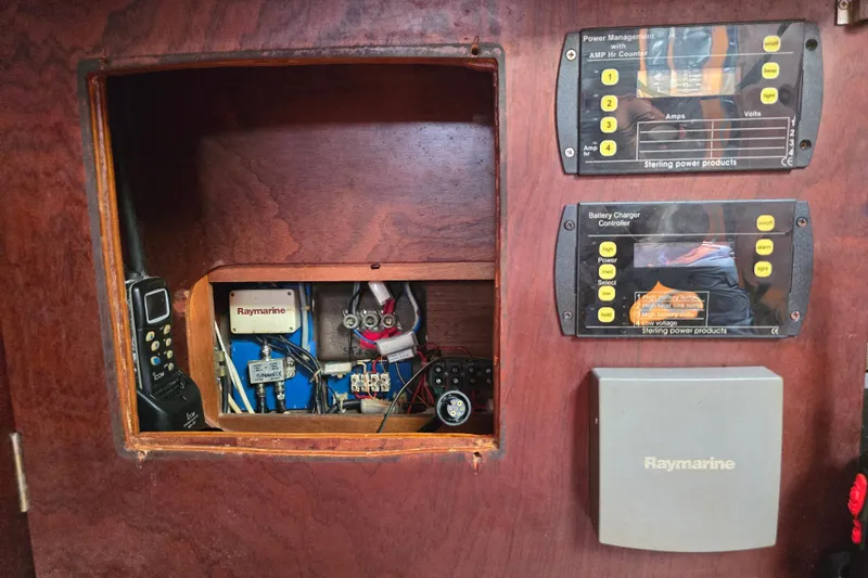 Blue Song Yacht Photos Pics Electrical panel of 1984 Amel Maramu 45 sailboat with Raymarine equipment.