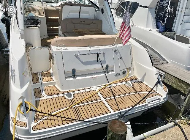  Yacht Photos Pics 2016 Sea Ray 330 Sundancer yacht docked, featuring spacious deck and American flag.