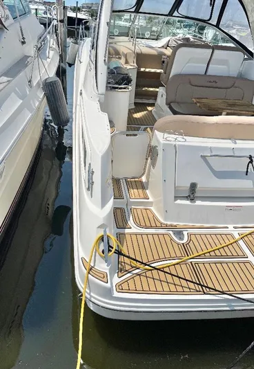  Yacht Photos Pics 2016 Sea Ray 330 Sundancer yacht docked, featuring spacious deck and seating area.