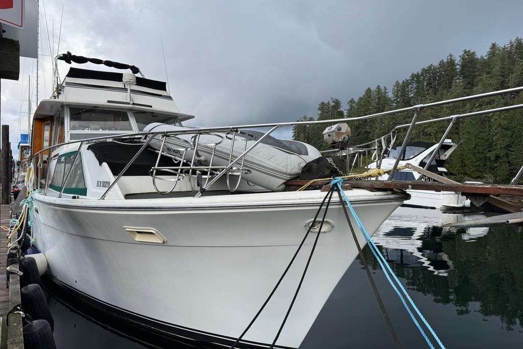 1977 Pacemaker 40 Motor Yacht docked in a serene marina setting.